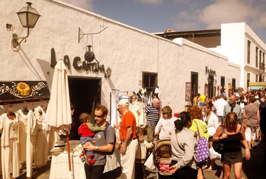 the sunday market in the old town of Teguise on the Island of Lanzarote on the Canary Islands of Spain in the Atlantic Ocean. on the Island of Lanzarote on the Canary Islands of Spain in the Atlantic Ocean..