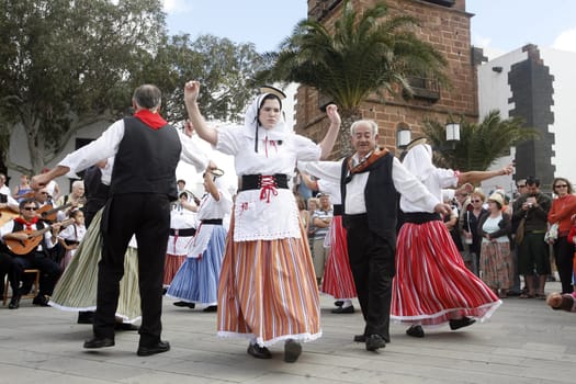 a traditional Dance in the old town of Teguise on the Island of Lanzarote on the Canary Islands of Spain in the Atlantic Ocean. on the Island of Lanzarote on the Canary Islands of Spain in the Atlantic Ocean..