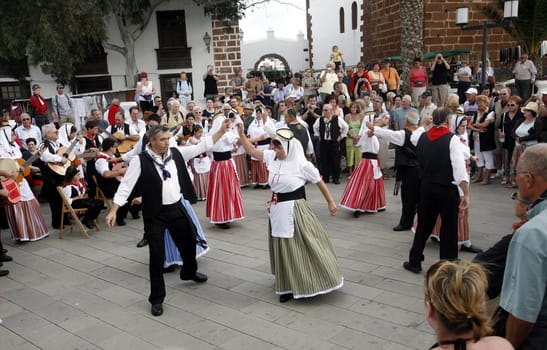 a traditional Dance in the old town of Teguise on the Island of Lanzarote on the Canary Islands of Spain in the Atlantic Ocean. on the Island of Lanzarote on the Canary Islands of Spain in the Atlantic Ocean..