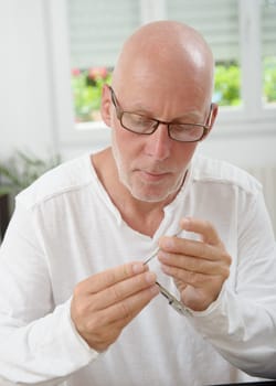 man with glasses repaired a smartphone