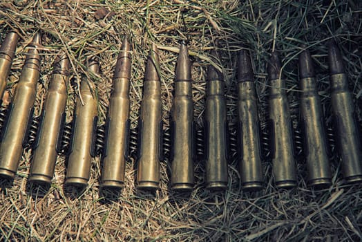 ammo to machine guns on grass,hdr