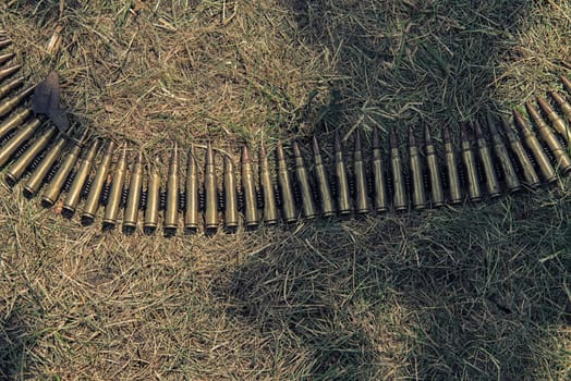 ammo to machine guns on grass,hdr