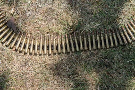 ammo to machine guns on grass