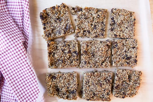 Fresh baked and cut quinoa breakfast on cutting board.