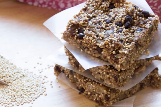 Three quinoa and chocolate chip breakfast bars close up
