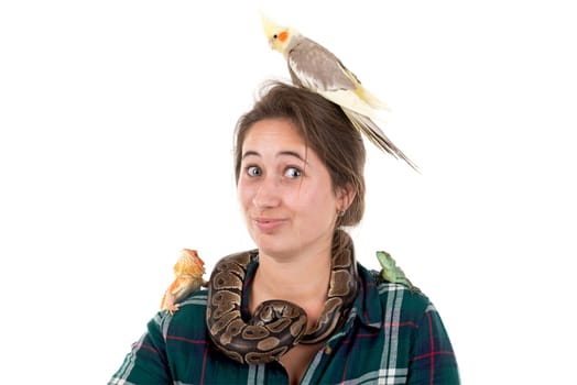 Girl with several pet animals isolated in white