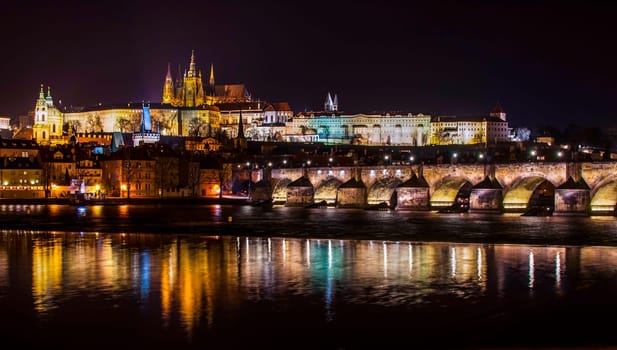castle,charles bridge and vltava river,night panorama of prague,czech republic