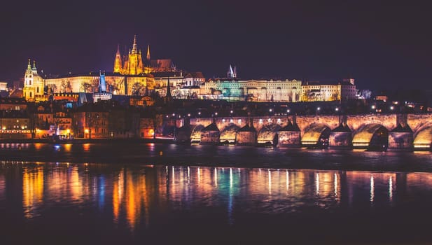 castle,charles bridge and vltava river,night panorama of prague,czech republic,vintage effect
