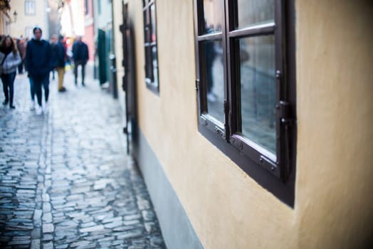 homes along the golden lane in prague castle,full of tourist,focus on window