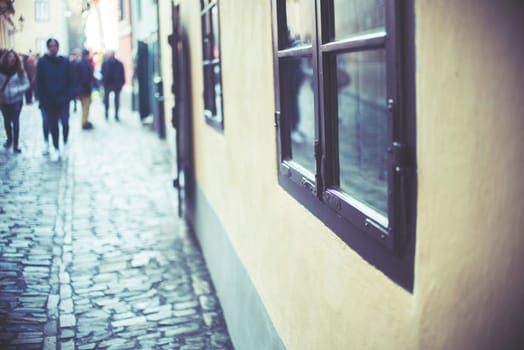 homes along the golden lane in prague castle,full of tourist,focus on window,vintage effect