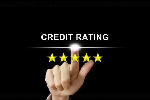 business hand clicking credit rating with five stars on screen