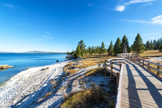 Lake shore and boardwalk in West Thumb Geyser Basin in Yellowstone National Park