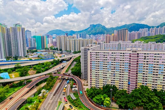 hong kong public estate with landmark lion rock at day
