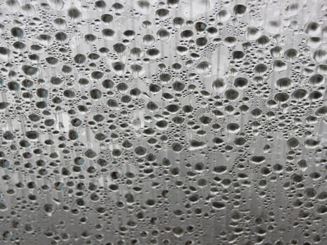 Water Damp Moisture Condensation under Striped Plastic Roof in a Small Outdoor Swimming Pool. Cold outside - but Warm Inside.