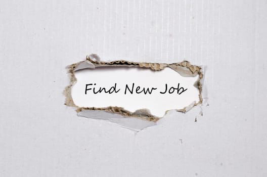 The word find new job appearing behind torn paper
