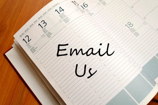 Email us text concept write on notebook