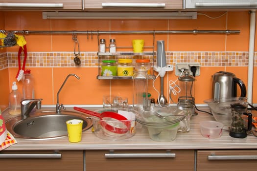 A pile of dirty dishes in the kitchen