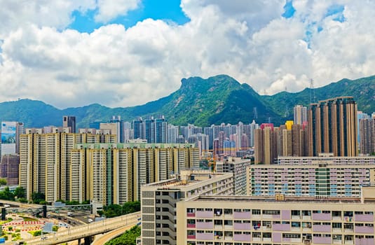 hong kong public estate buildings with landmark lion rock at day