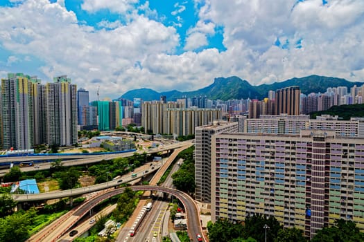 hong kong public estate with landmark lion rock at day