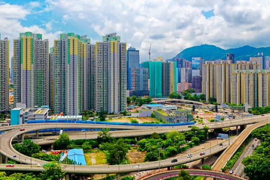 hong kong public estate with landmark lion rock at day