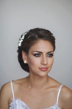 Portrait of Beautiful Bride in Wedding Dress and Decoration.