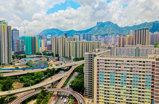 hong kong public estate buildings with landmark lion rock at day