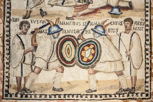 Madrid, Spain - July 11, 2016: Roman polychrome mosaic with the representation fighting gladiators at National Archeological Museum of Madrid