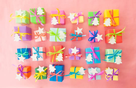 Small gifts wrapped in colorful paper with small ribbons