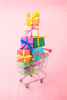 Small gifts wrapped in colorful paper with small ribbons