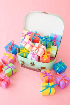 Small gifts wrapped in colorful paper with small ribbons