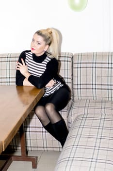 the beautiful young woman at a table in cafe, a subject beautiful women