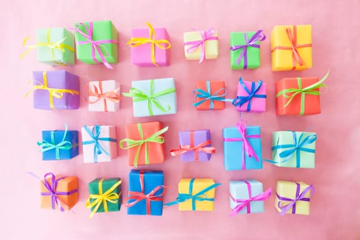 Small gifts wrapped in colorful paper with small ribbons