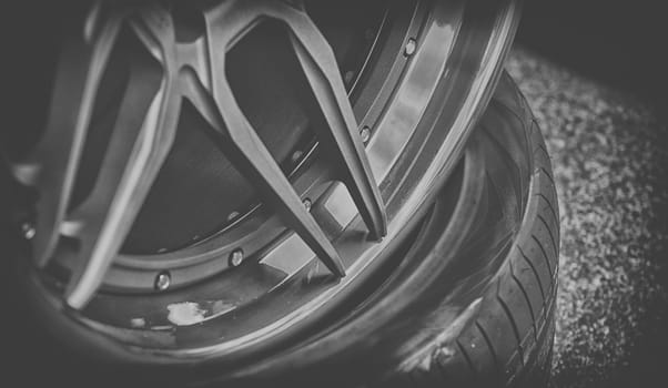 closeup detail of aluminum car wheel,black and white