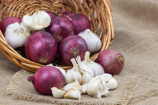 Fresh garlic and onion in a basket