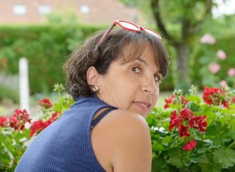 a portrait of a beautiful mature woman with glasses