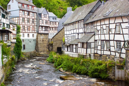picturesque houses along the Rur River in the historic center of Monschau, Germany