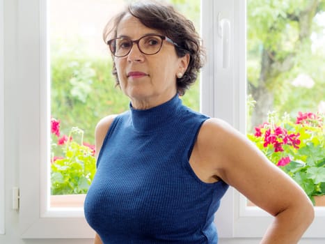a portrait of a beautiful mature woman with glasses