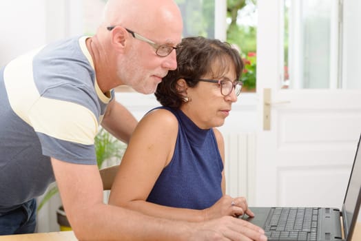 a mature couple with a laptop