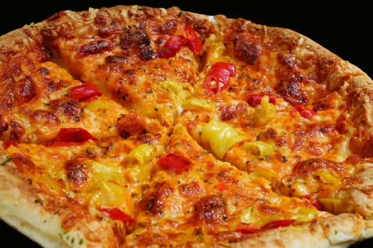 Fresh pizza on a black background