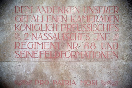 Mainz,Germany - April 07,2016: An inscription commemorating fallen Prussian soldiers at the main cemetery of the city of Mainz in Latin and German script on April 7,2016 in Mainz.
