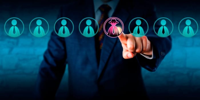 Corporate security manager identifies a potential insider threat in a line-up of eight white collar workers. Hacker or spy icon lights up purple. Cybersecurity and human resources challenge concept.