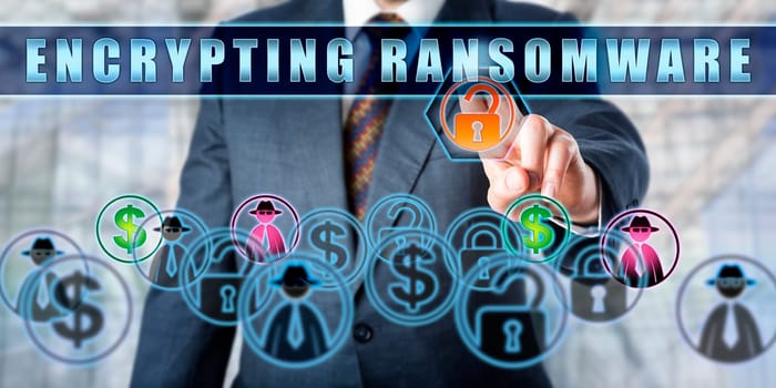 Corporate user is pressing ENCRYPTING RANSOMWARE on an interactive touch screen. Computer security concept for extortionate ransomware, a malicious software attack that restricts data access.