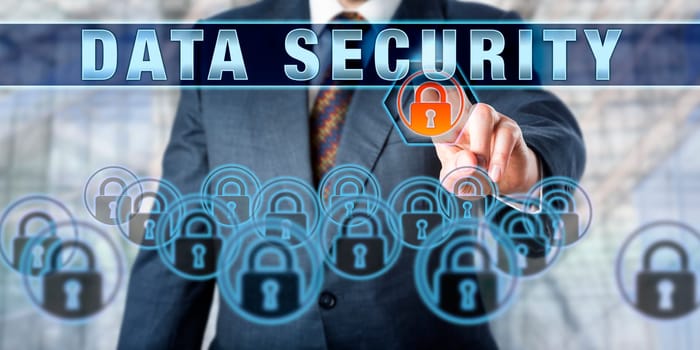 Male corporate executive is pushing DATA SECURITY on a touch screen interface. Business and security industry metaphor. Information technology concept for data management and protection.