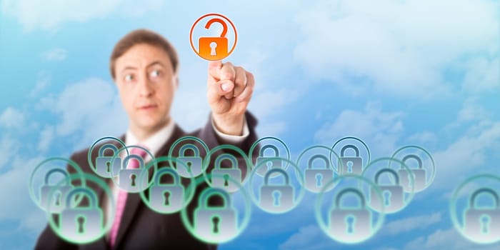 Manager is looking at a virtual padlock he is opening by touch in midair. Concept for data security, access control, cloud computing, information technology governance and data resource management.