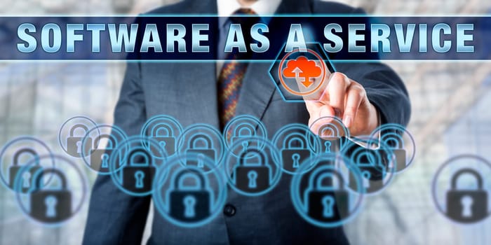 Manager is touching SOFTWARE AS A SERVICE on an interactive control screen. Business concept. Cloud computing metaphor for software delivery methods, services management and SaaS.