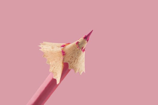 Front view of pink pencil with wooden shaving on top