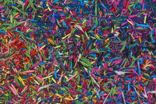 Horizontal top view of colorful remains on pencil sharpening