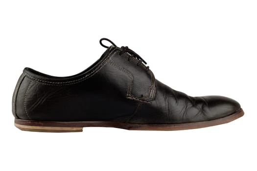 Horizontal side view of an elegant old black leather shoe isolated on white background