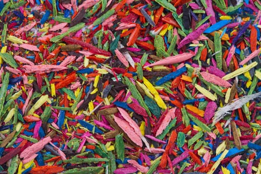 Horizontal top view of colorful remains on pencil sharpening