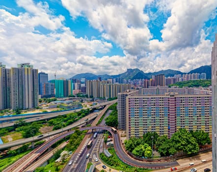 hong kong public estate buildings with landmark lion rock at day